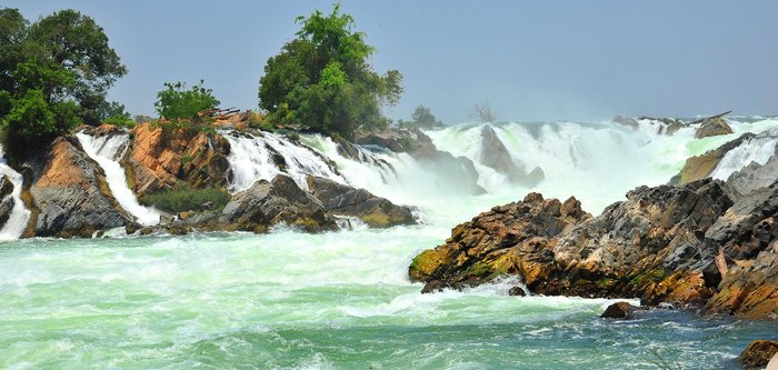 Khone Phapheng Wasserfall im Süden von Laos. Eine faszinierende und ursprüngliche Region, die Sie in eine Indochina Reise inkludieren können.
