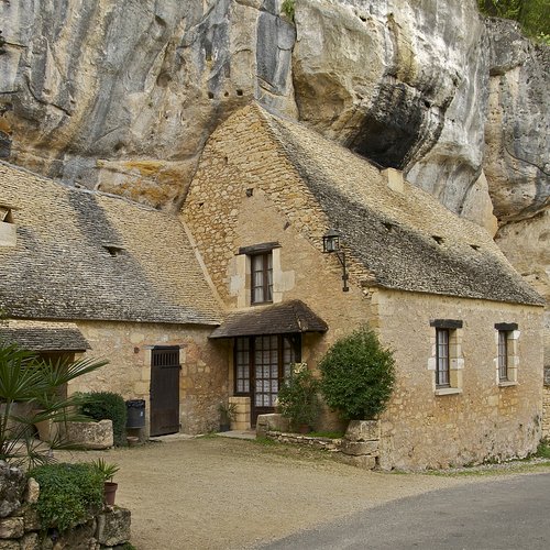 Grotte de Sorcier, Troglodyte houses, still in use, near of the entry of the "Sorcerer's cave, Saint-Cirq, Dordogne, France